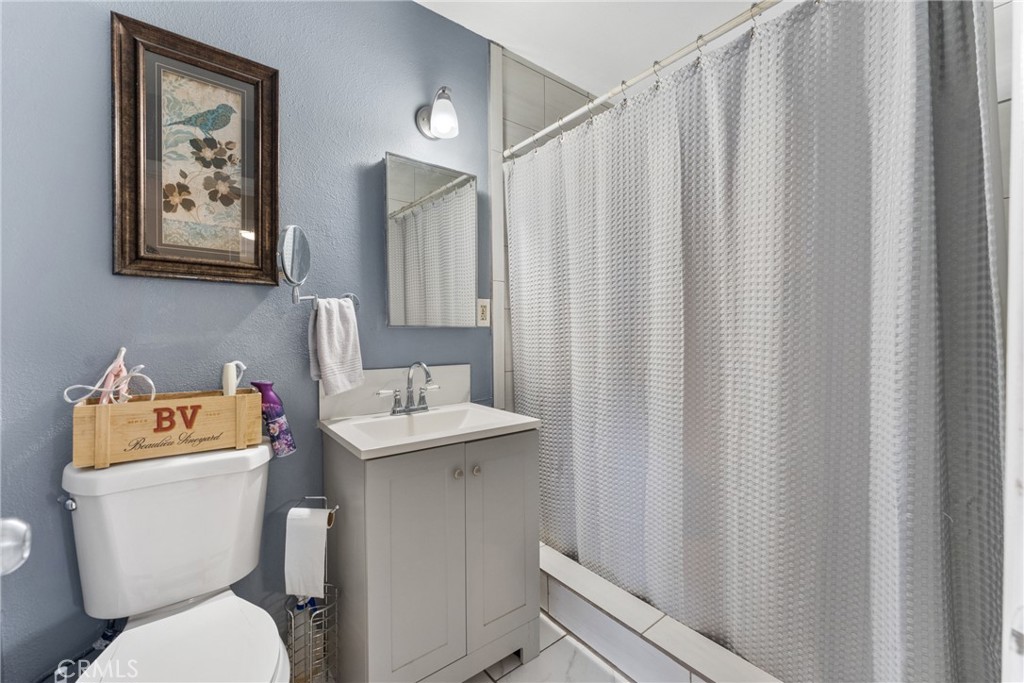 276 East Merrill Avenue Rialto, CA 92376 - Photo 29 of 35 a white toilet sitting next to a small bathroom
