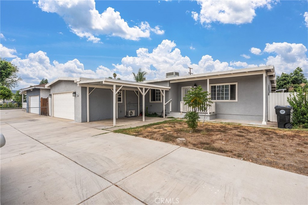 276 East Merrill Avenue Rialto, CA 92376 - Photo 3 of 35 a view of a house with a yard and potted plants