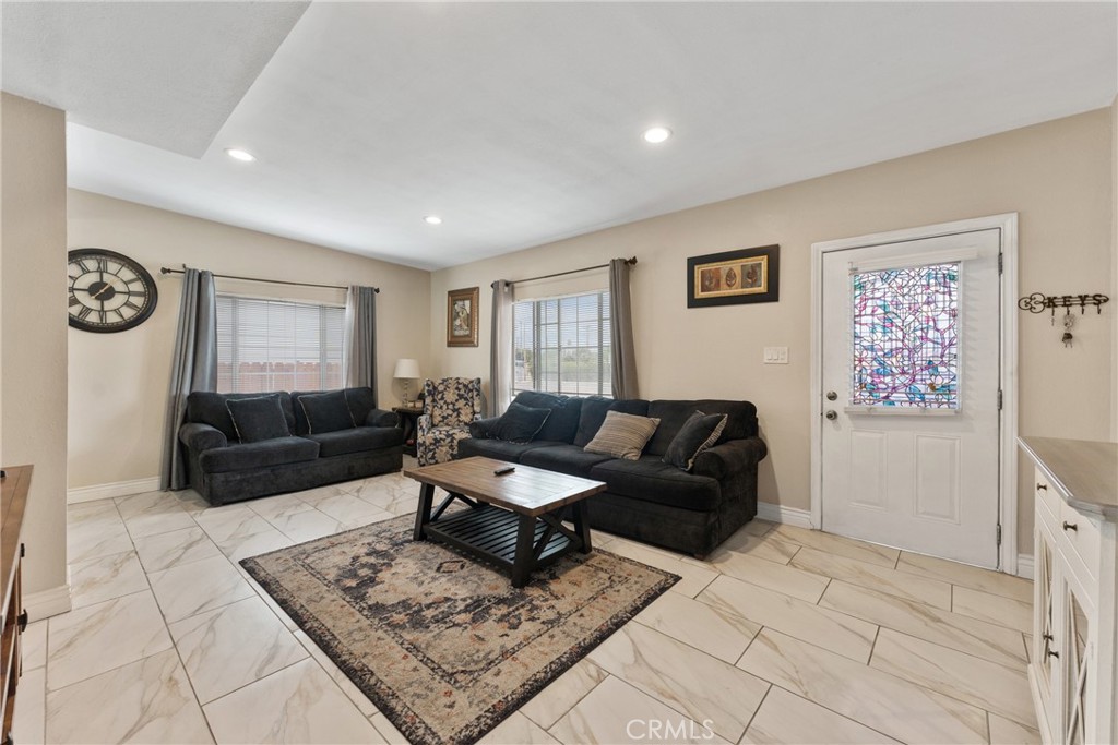 276 East Merrill Avenue Rialto, CA 92376 - Photo 10 of 35 a living room with furniture and a window