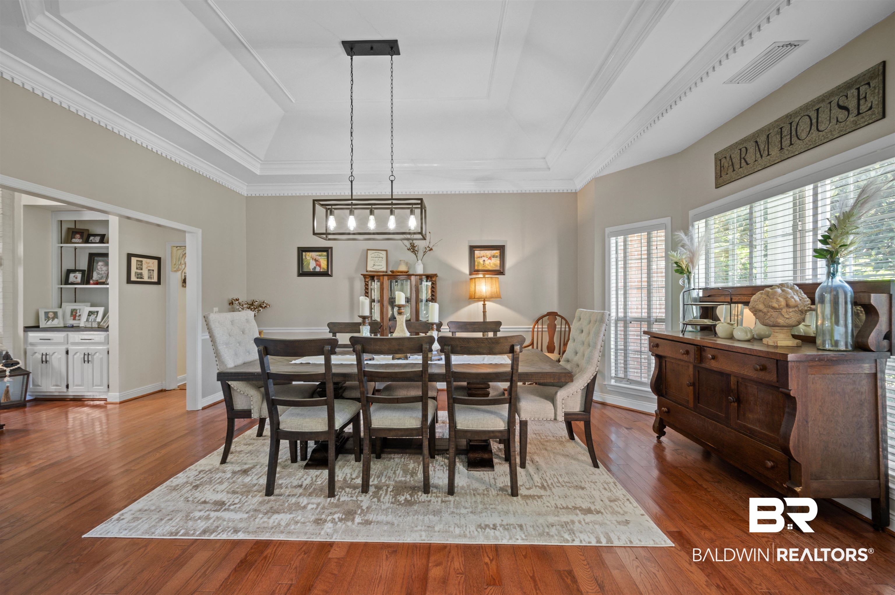 141 Blue Ridge Drive Monroeville, AL 36460 - Photo 3 of 40 Dining room featuring a raised ceiling, wood finished floors, and crown molding