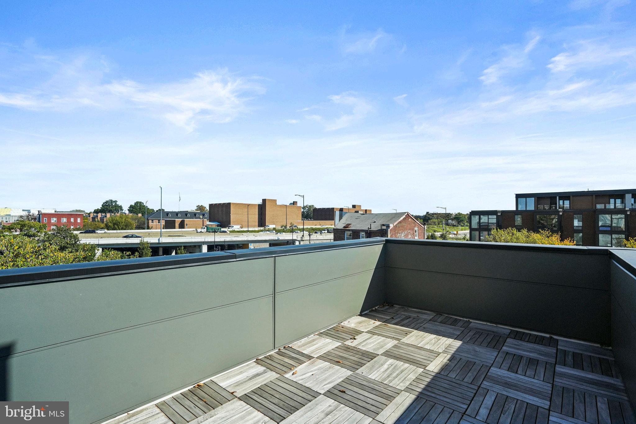 716 L Street Southeast, Unit 403 Washington, DC 20003 - Photo 14 of 17 a terrace with a table and chairs