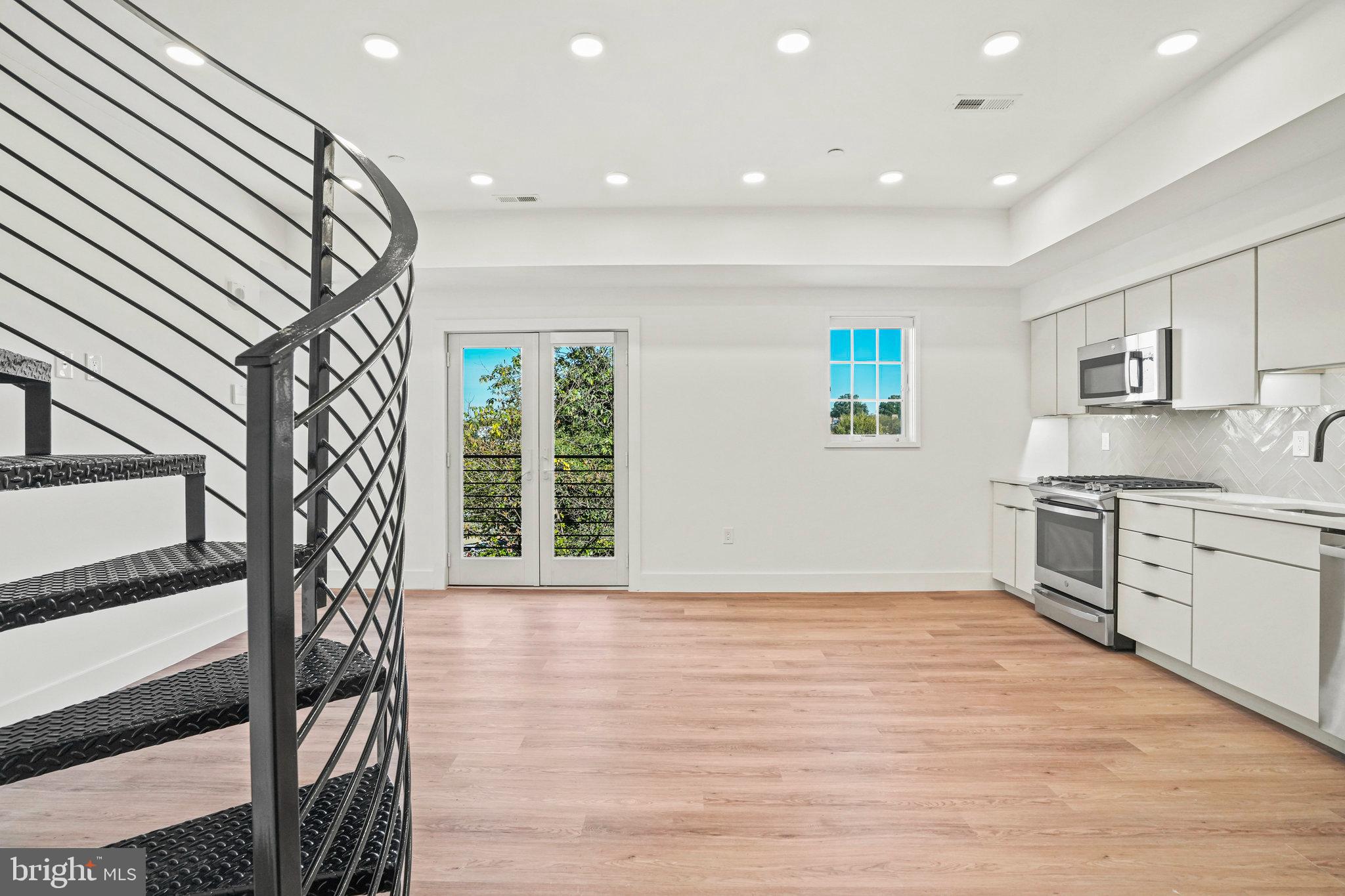 716 L Street Southeast, Unit 403 Washington, DC 20003 - Photo 7 of 17 a view of livingroom with kitchen and workspace