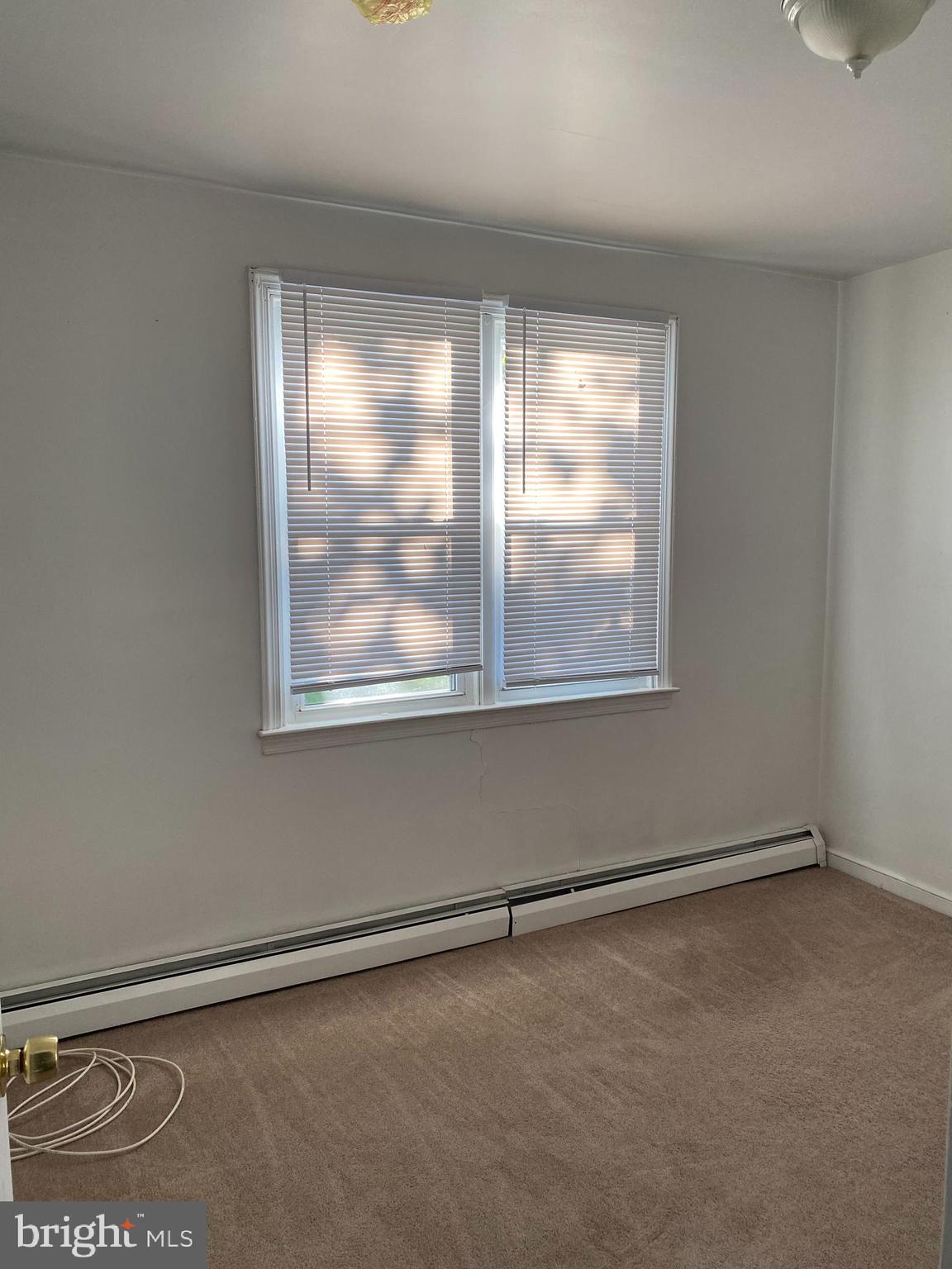 1171 West County Line Road Hatboro, PA 19040 - Photo 12 of 22 an empty room with a window