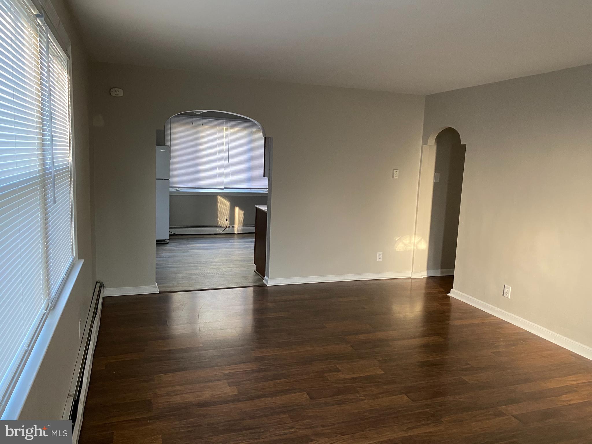 1171 West County Line Road Hatboro, PA 19040 - Photo 10 of 22 an empty room with wooden floor and mirror