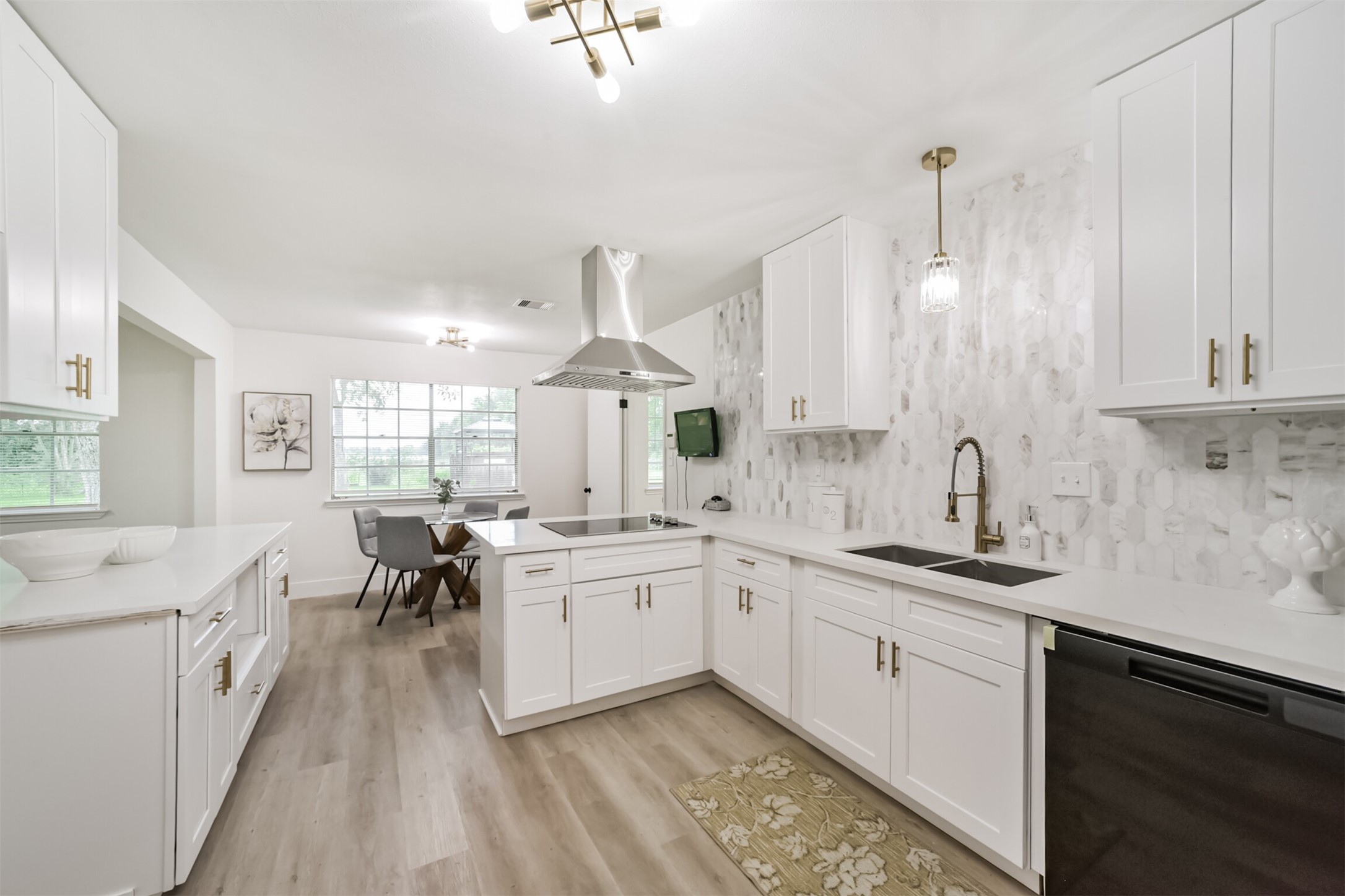 5403 Croix Road Manvel, TX 77578 - Photo 16 of 25 Beautifully remodeled kitchen featuring new cabinetry, quartz countertops, designer backsplash and modern finishes throughout.