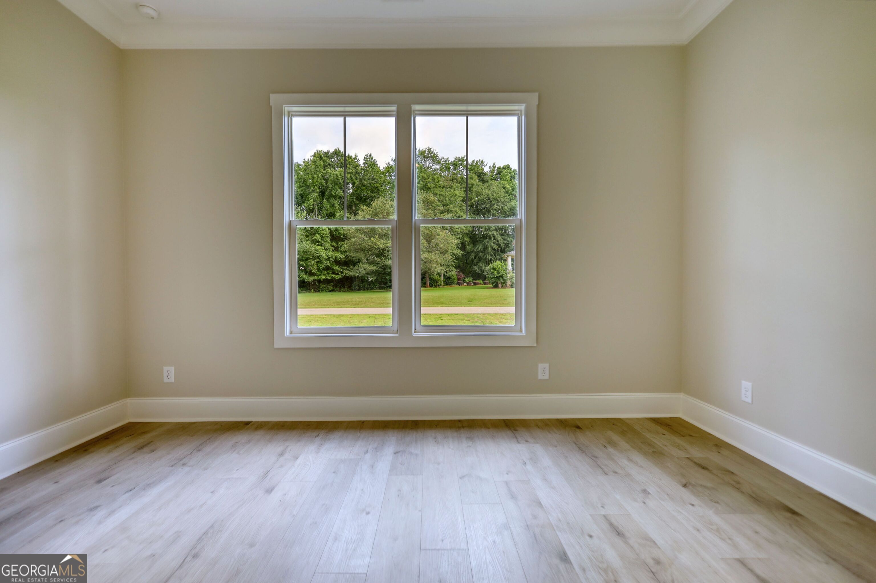 1031 Graham Drive Madison, GA 30650 - Photo 27 of 78 wooden floor and window in an empty room