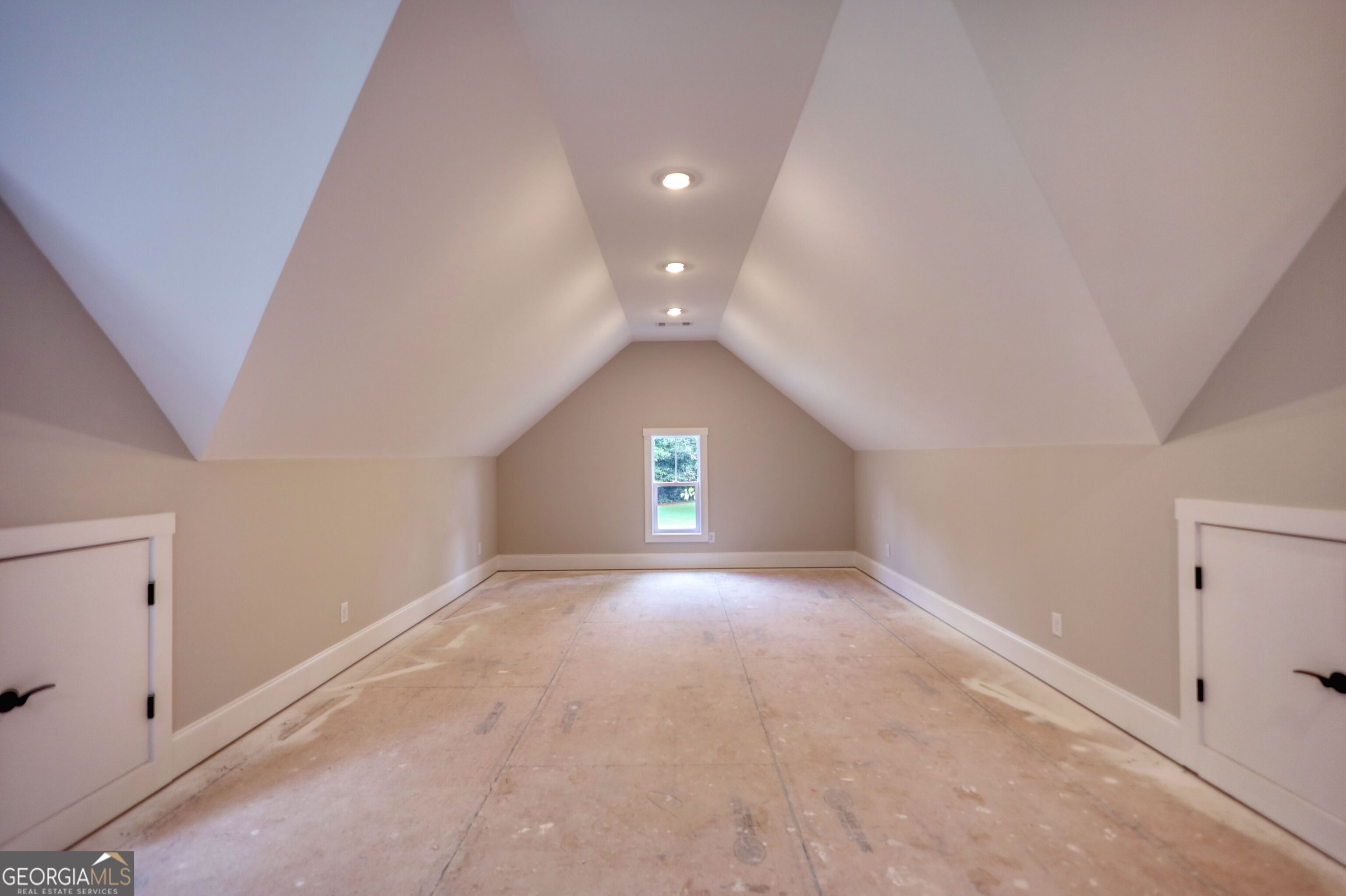 1031 Graham Drive Madison, GA 30650 - Photo 61 of 78 a view of an empty room with a window and a kitchen