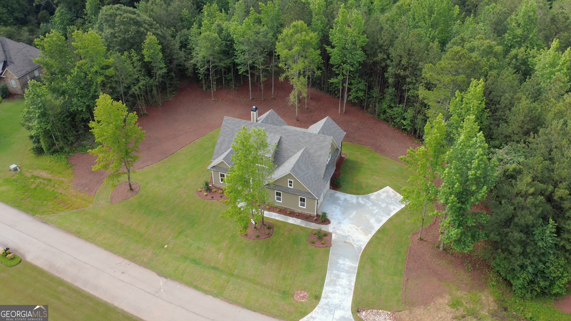 1031 Graham Drive Madison, GA 30650 - Photo 7 of 78 an aerial view of a house with outdoor space and a lake view