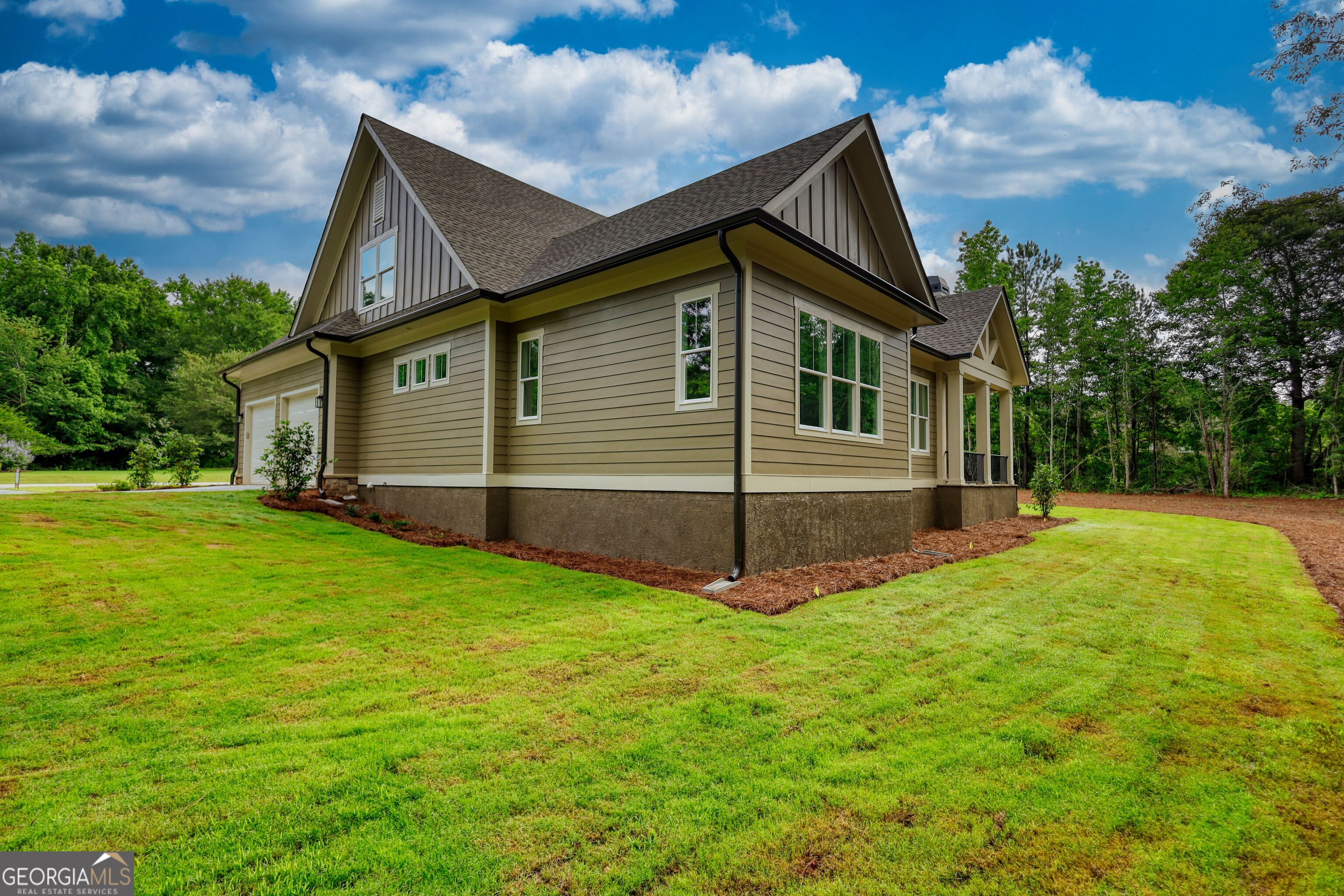 1031 Graham Drive Madison, GA 30650 - Photo 73 of 78 a view of backyard with a garden and trees