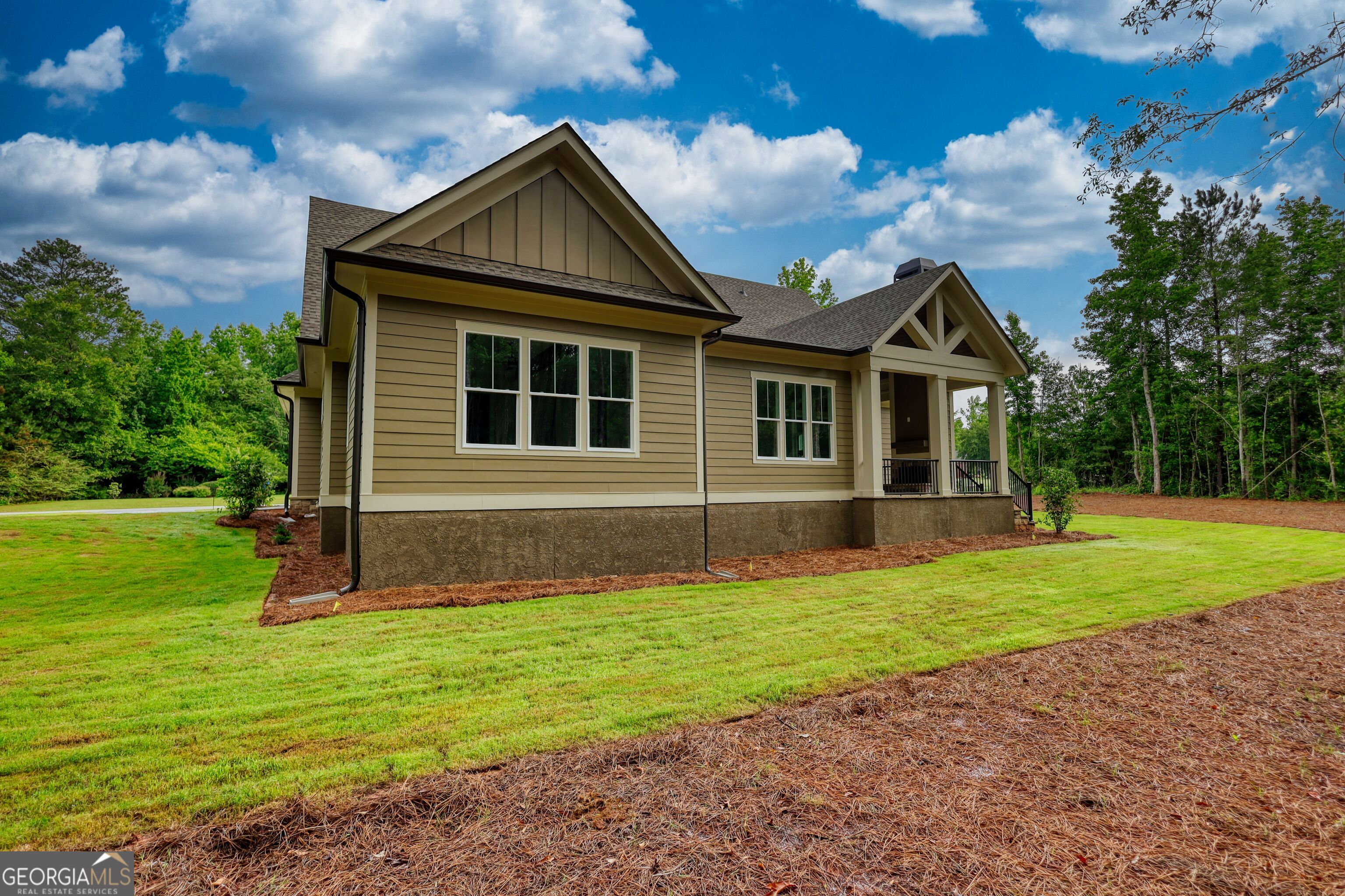1031 Graham Drive Madison, GA 30650 - Photo 74 of 78 a front view of a house with garden