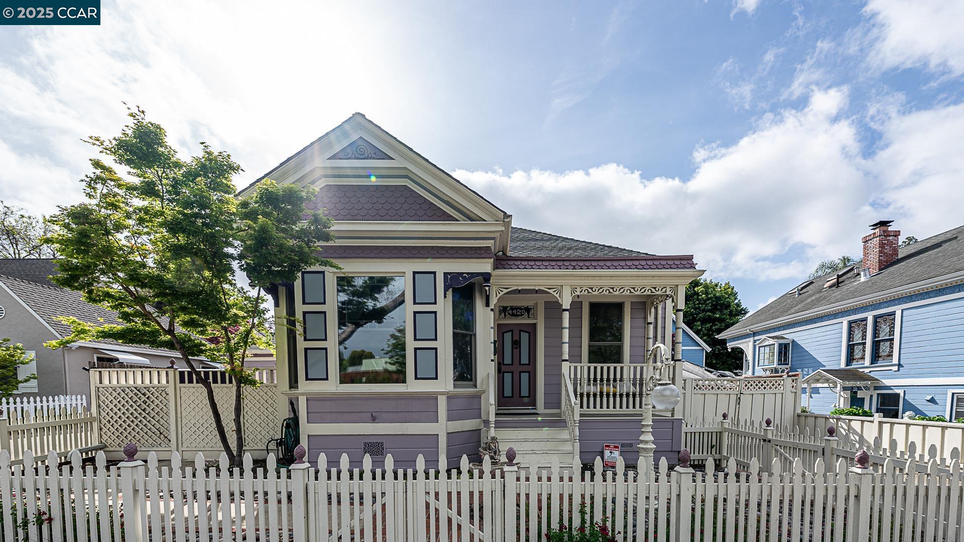 a front view of house with a garden