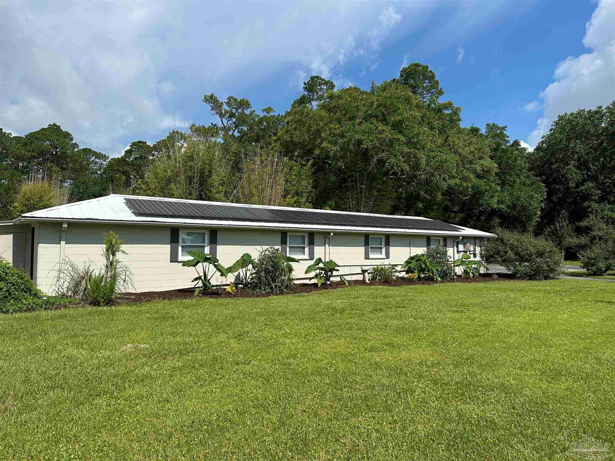 3375 Robinson Point Road Milton, FL 32583 - Photo 24 of 50 front view of a house with a yard
