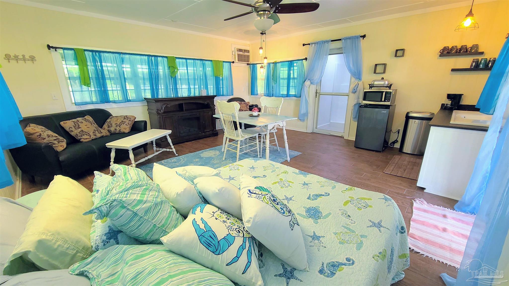 3375 Robinson Point Road Milton, FL 32583 - Photo 34 of 50 a living room with furniture and a large window
