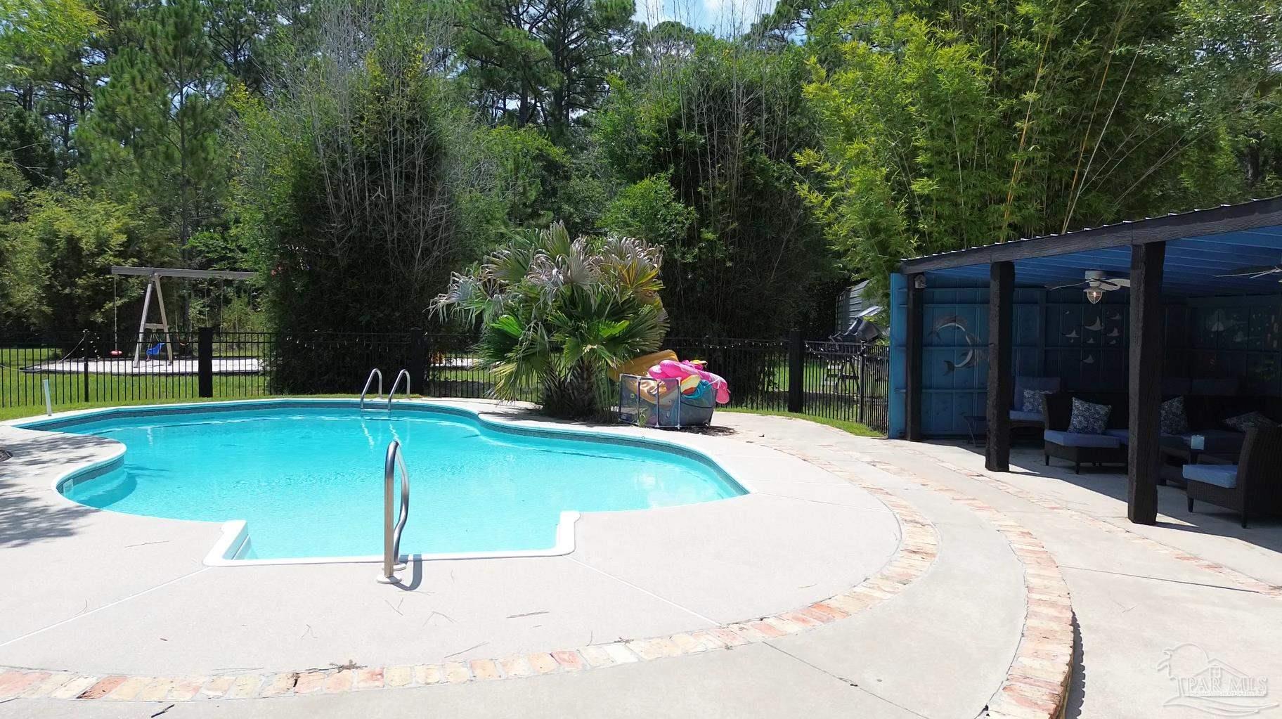 3375 Robinson Point Road Milton, FL 32583 - Photo 42 of 50 a house view with a garden space