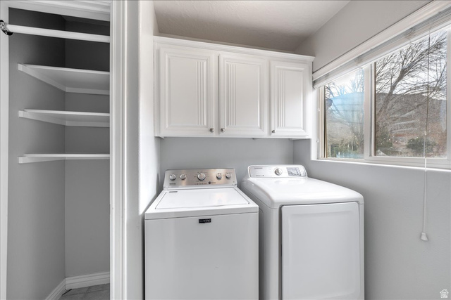 7 Reflection Way St. George, UT 84770 - Photo 23 of 54 Laundry area featuring cabinet space and separate washer and dryer