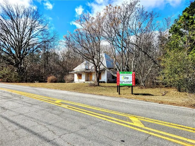 a view of park with large trees