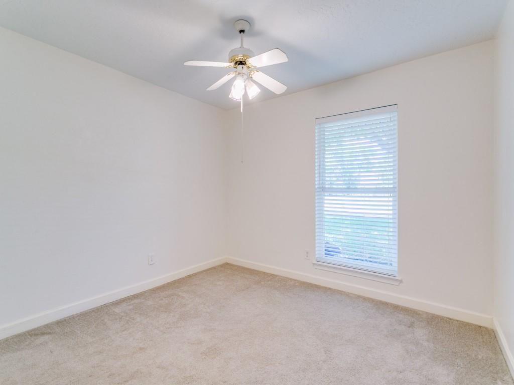 510 Copper Ridge Drive Richardson, TX 75080 - Photo 11 of 25 an empty room with a window and a fan