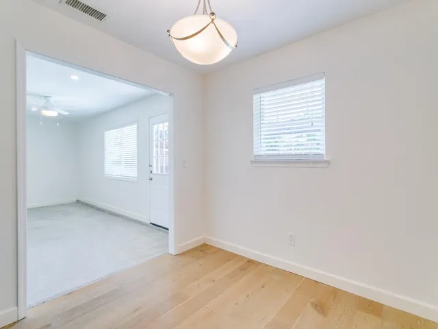 an empty room with windows