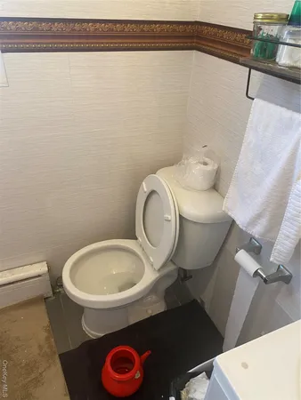 a bathroom with a toilet and a sink