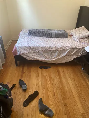 a bedroom with a bed and a table