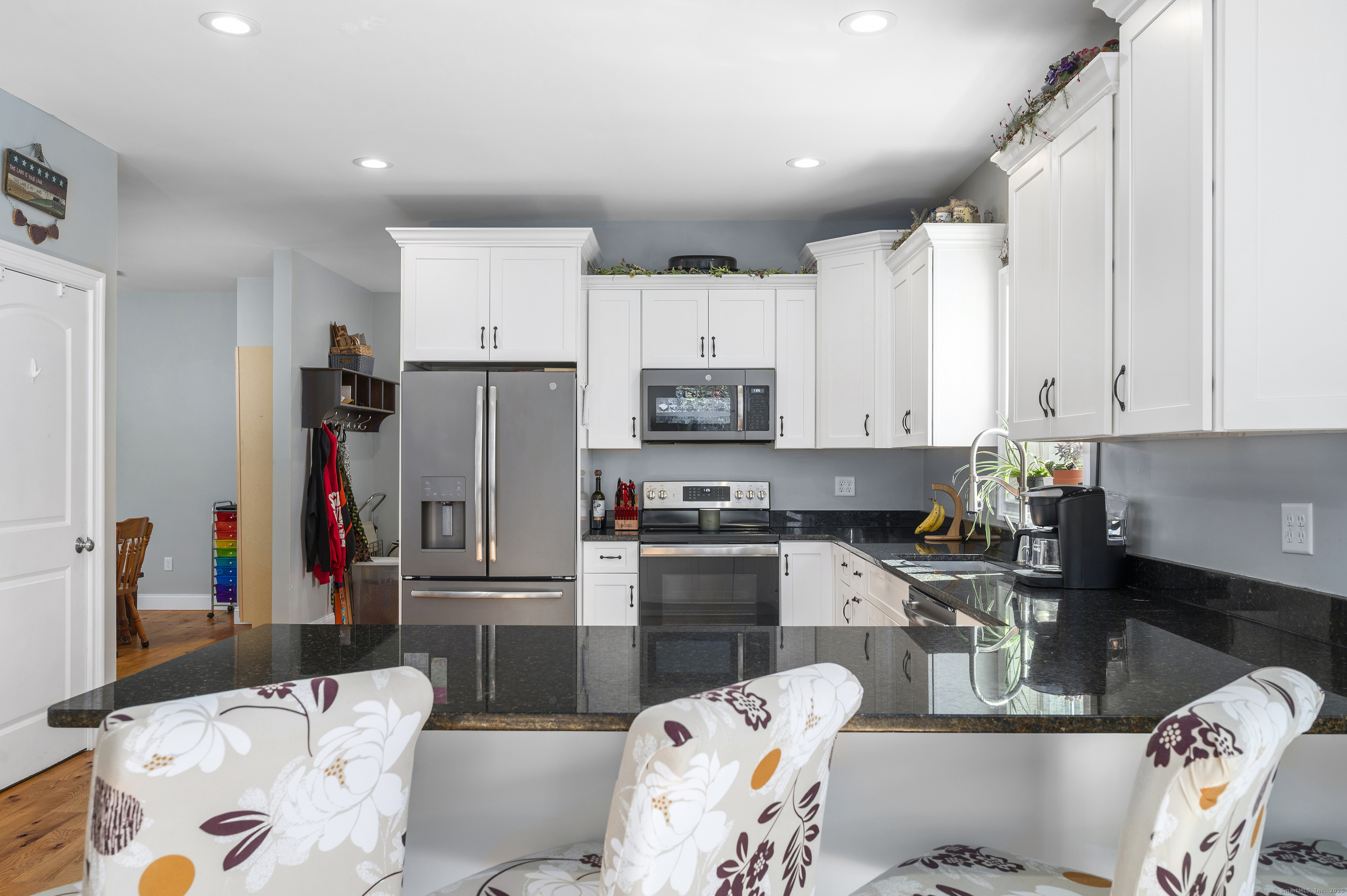 153 Wauregan Road Canterbury, CT 06331 - Photo 19 of 40 a kitchen with stainless steel appliances kitchen island granite countertop a refrigerator and microwave