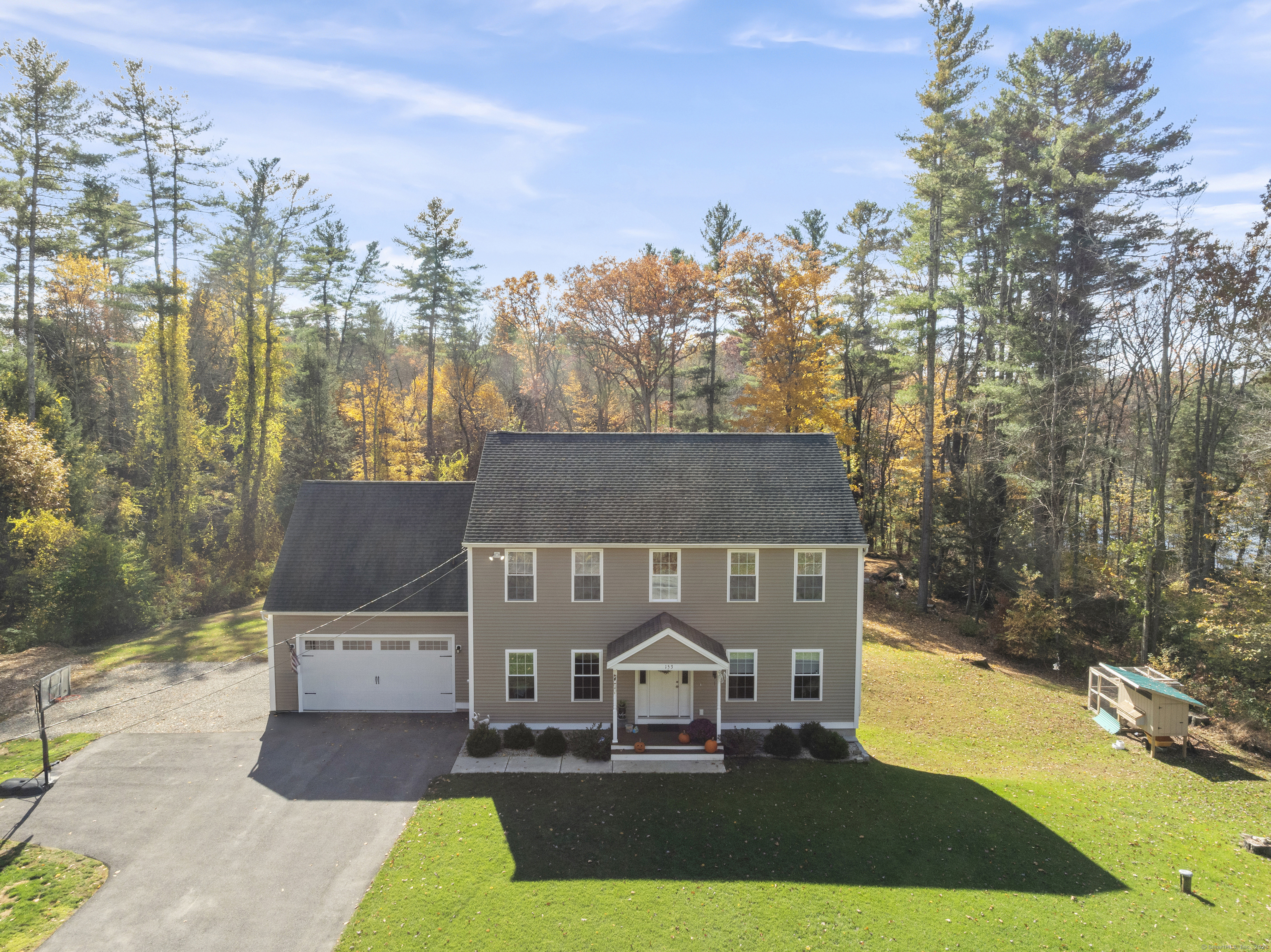 153 Wauregan Road Canterbury, CT 06331 - Photo 2 of 40 a view of a house with a yard and mountain view