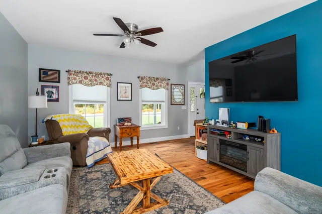 a living room with furniture and a rug