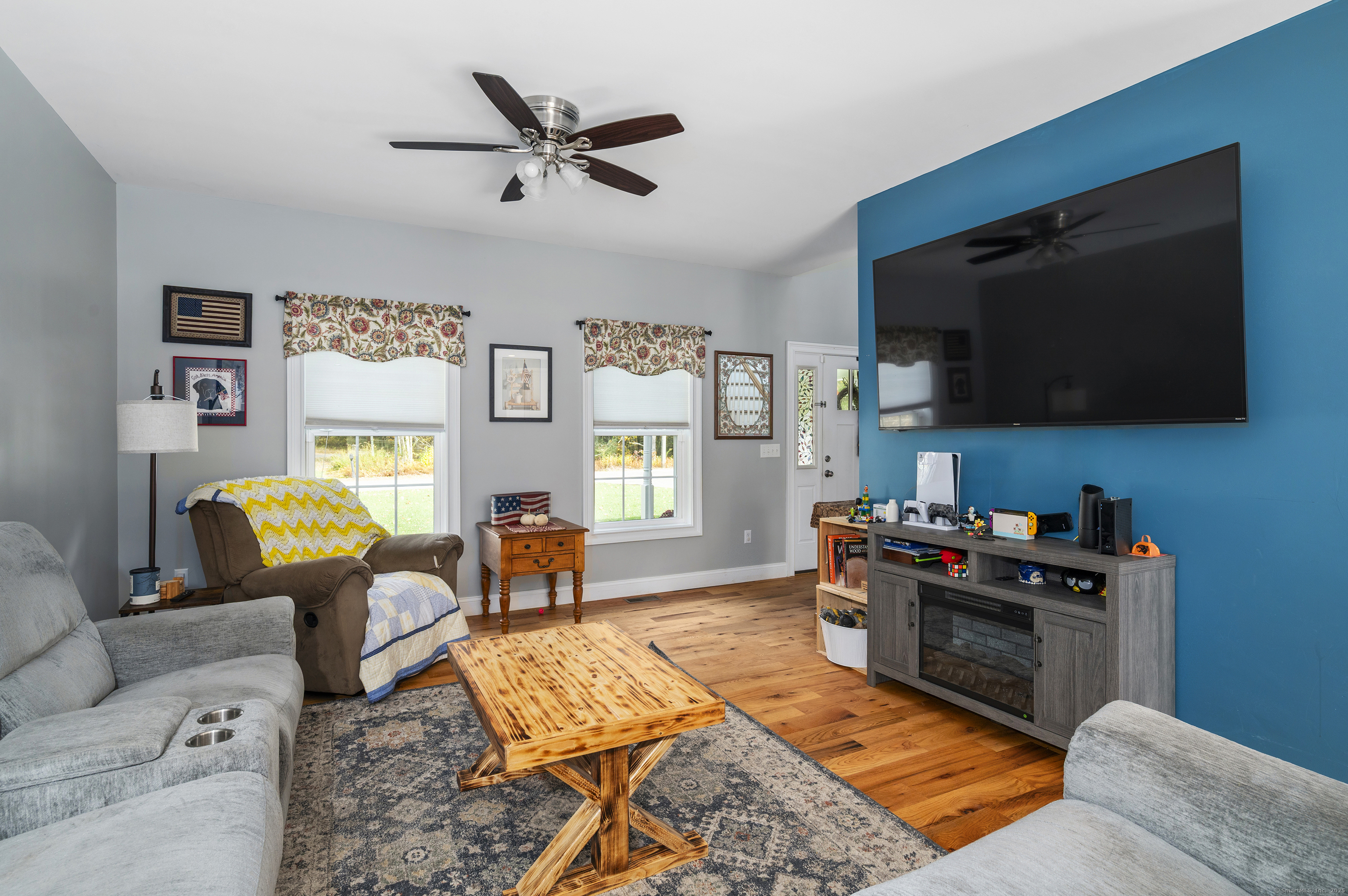 153 Wauregan Road Canterbury, CT 06331 - Photo 22 of 40 a living room with furniture and a flat screen tv