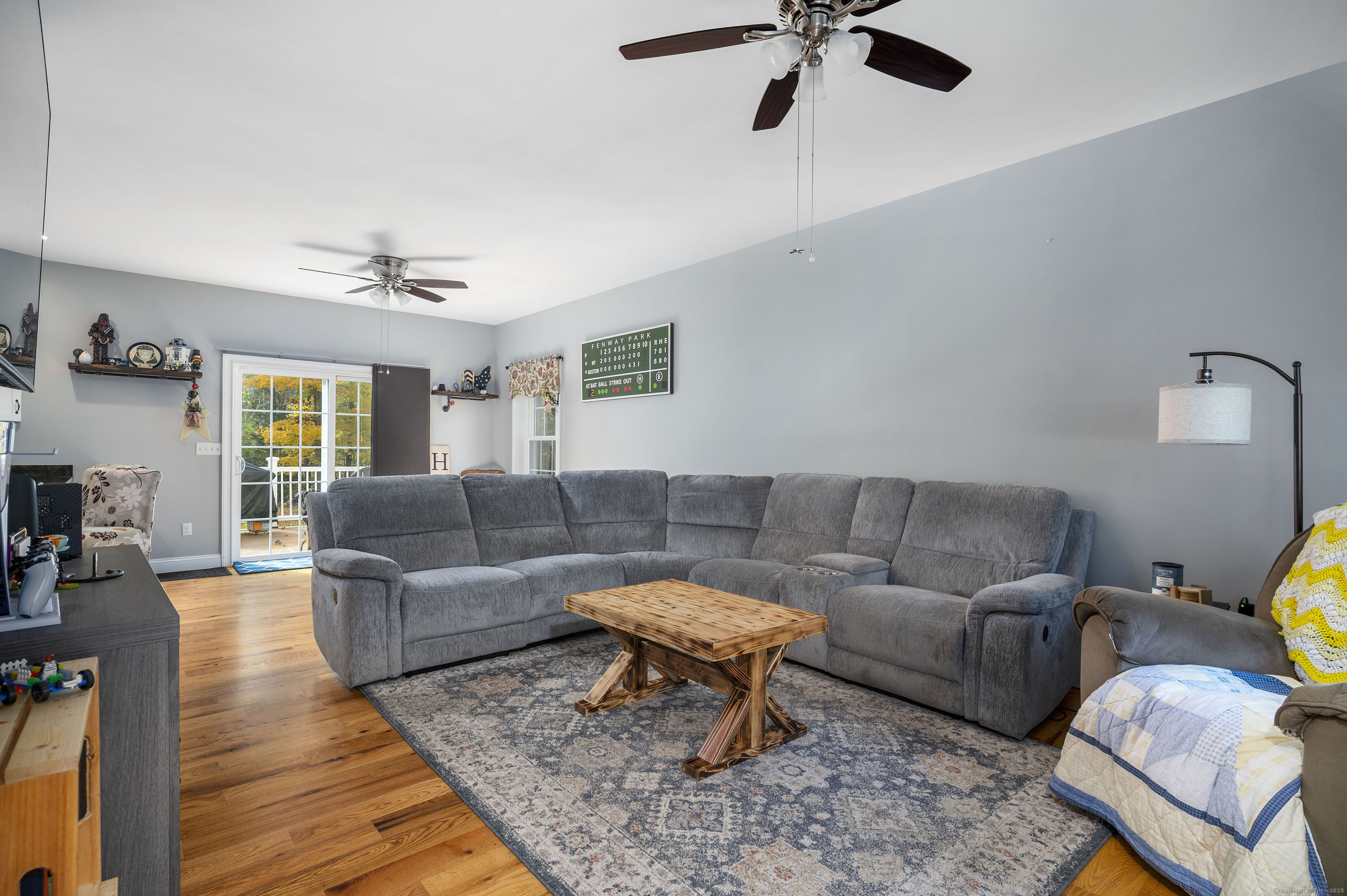 153 Wauregan Road Canterbury, CT 06331 - Photo 23 of 40 a living room with furniture and a rug