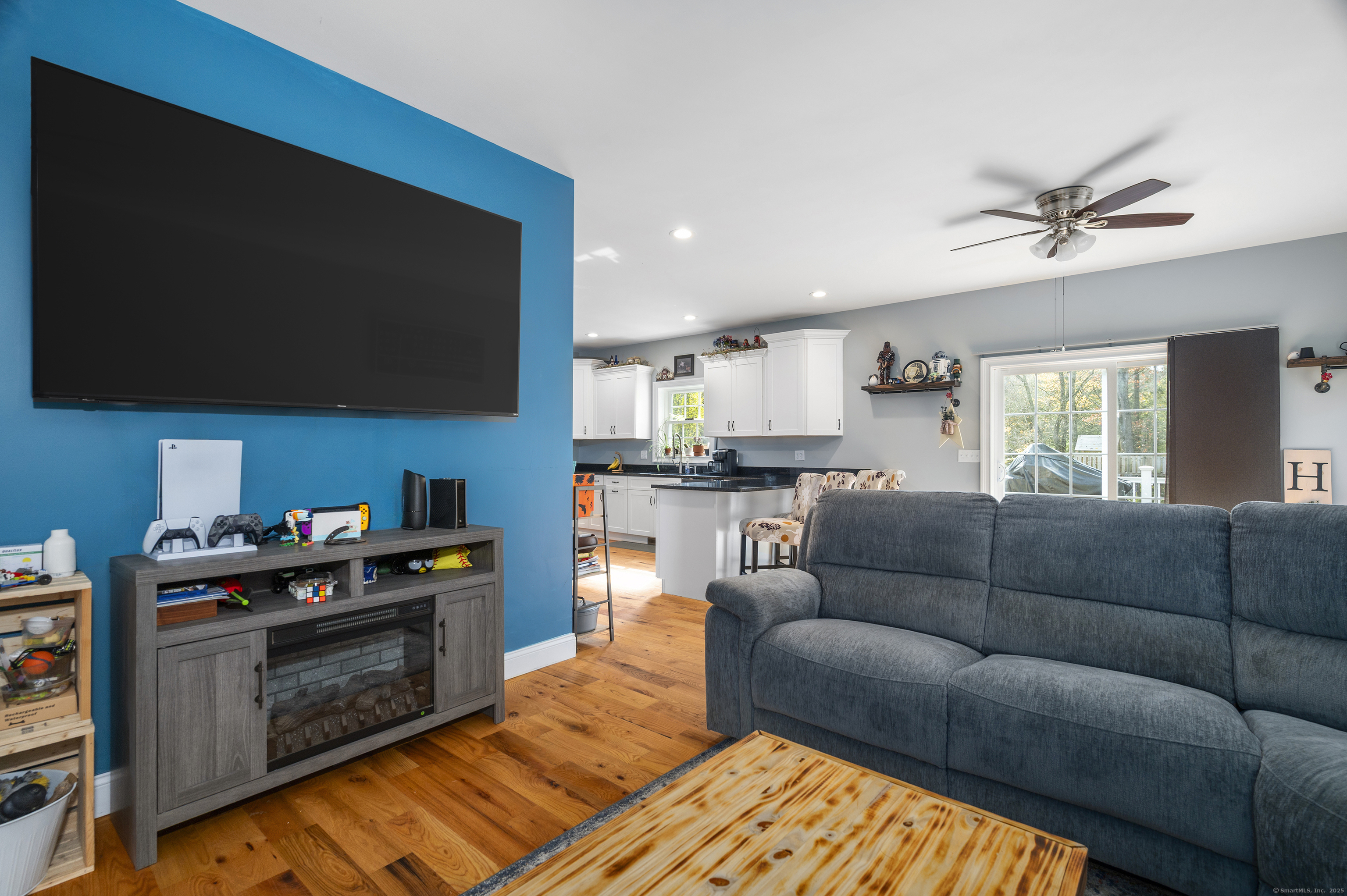 153 Wauregan Road Canterbury, CT 06331 - Photo 24 of 40 a living room with furniture and a flat screen tv