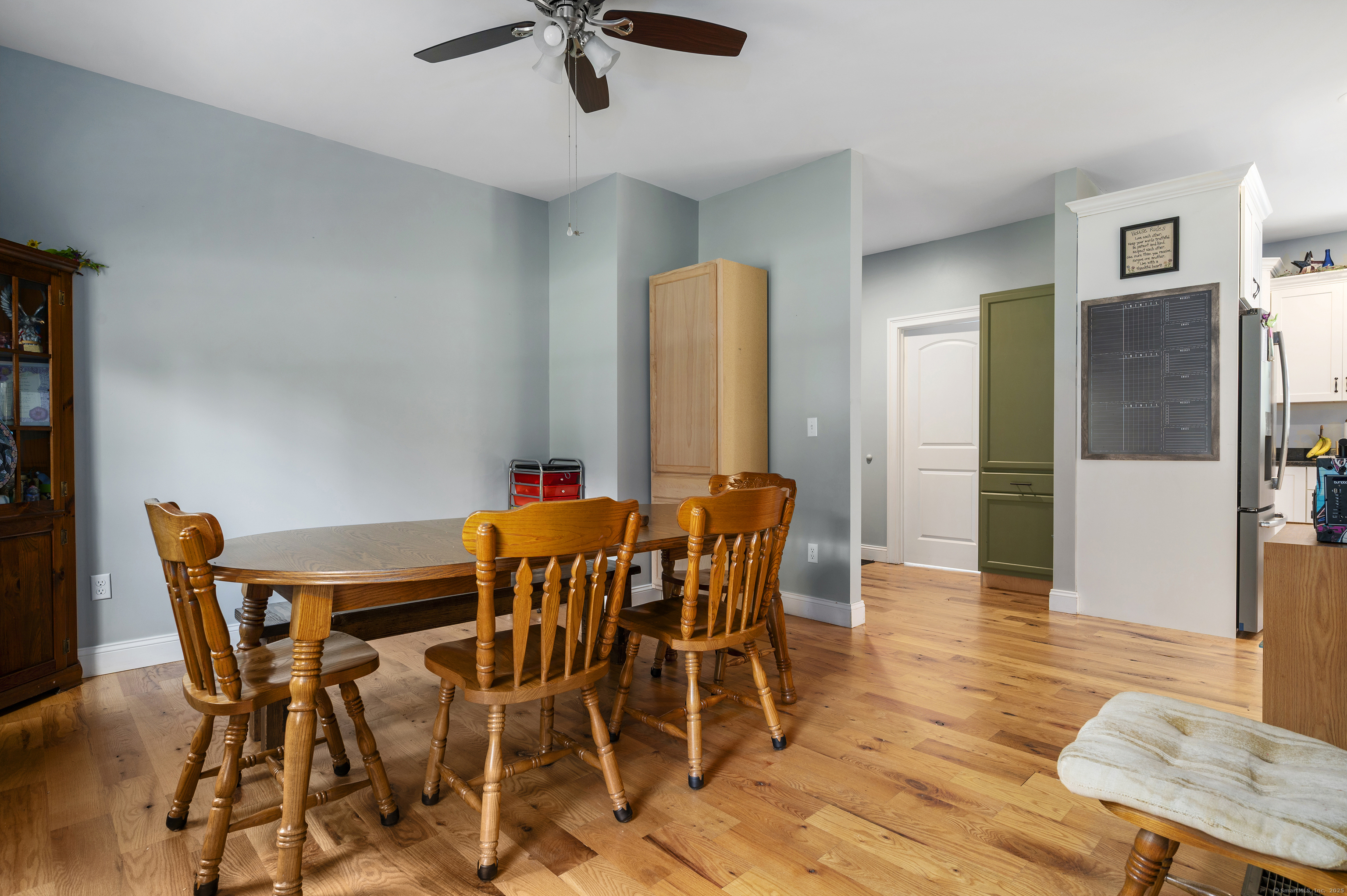 153 Wauregan Road Canterbury, CT 06331 - Photo 28 of 40 a view of a dining room with furniture and wooden floor