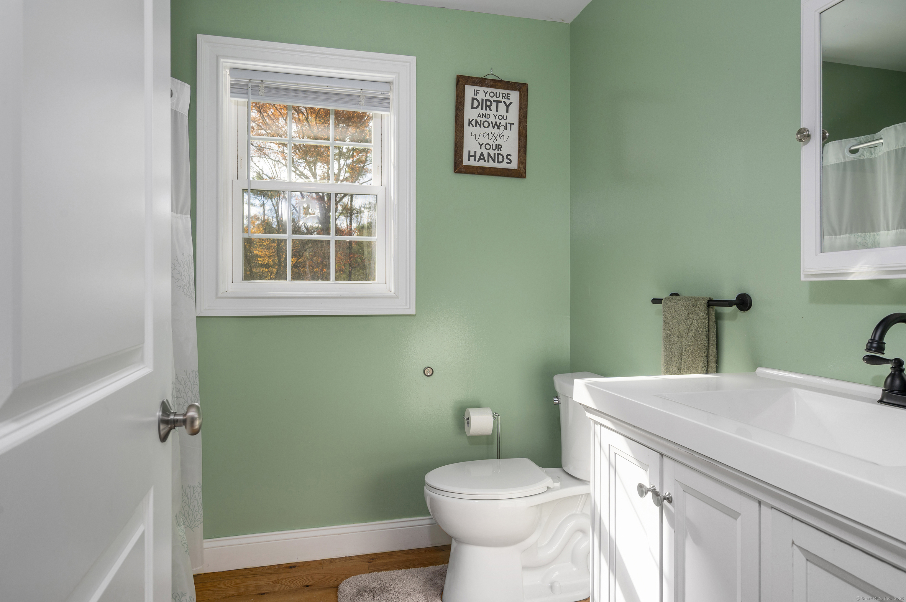 153 Wauregan Road Canterbury, CT 06331 - Photo 36 of 40 a bathroom with a sink and a toilet