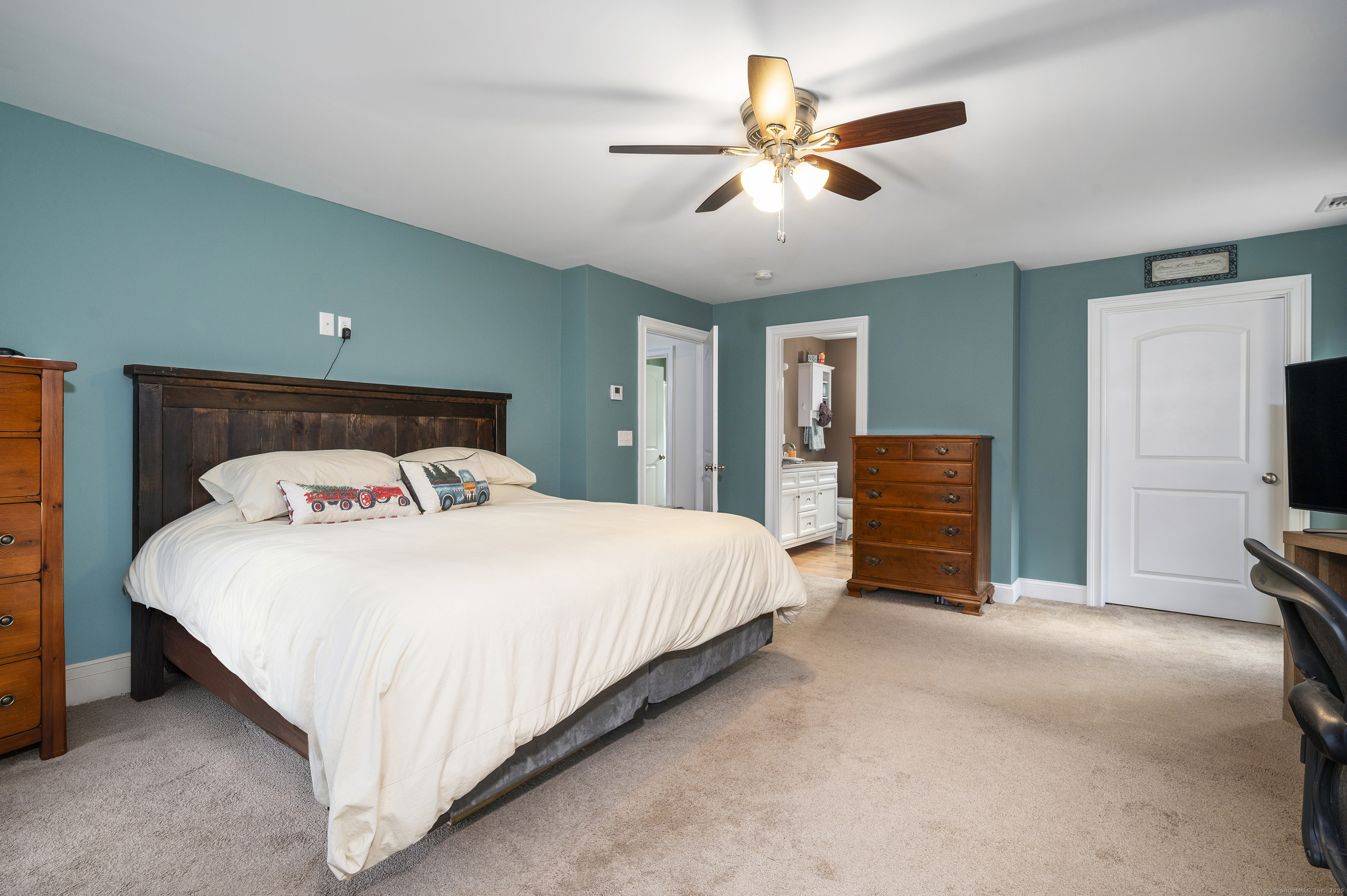 153 Wauregan Road Canterbury, CT 06331 - Photo 37 of 40 a bedroom with a large bed and a tv