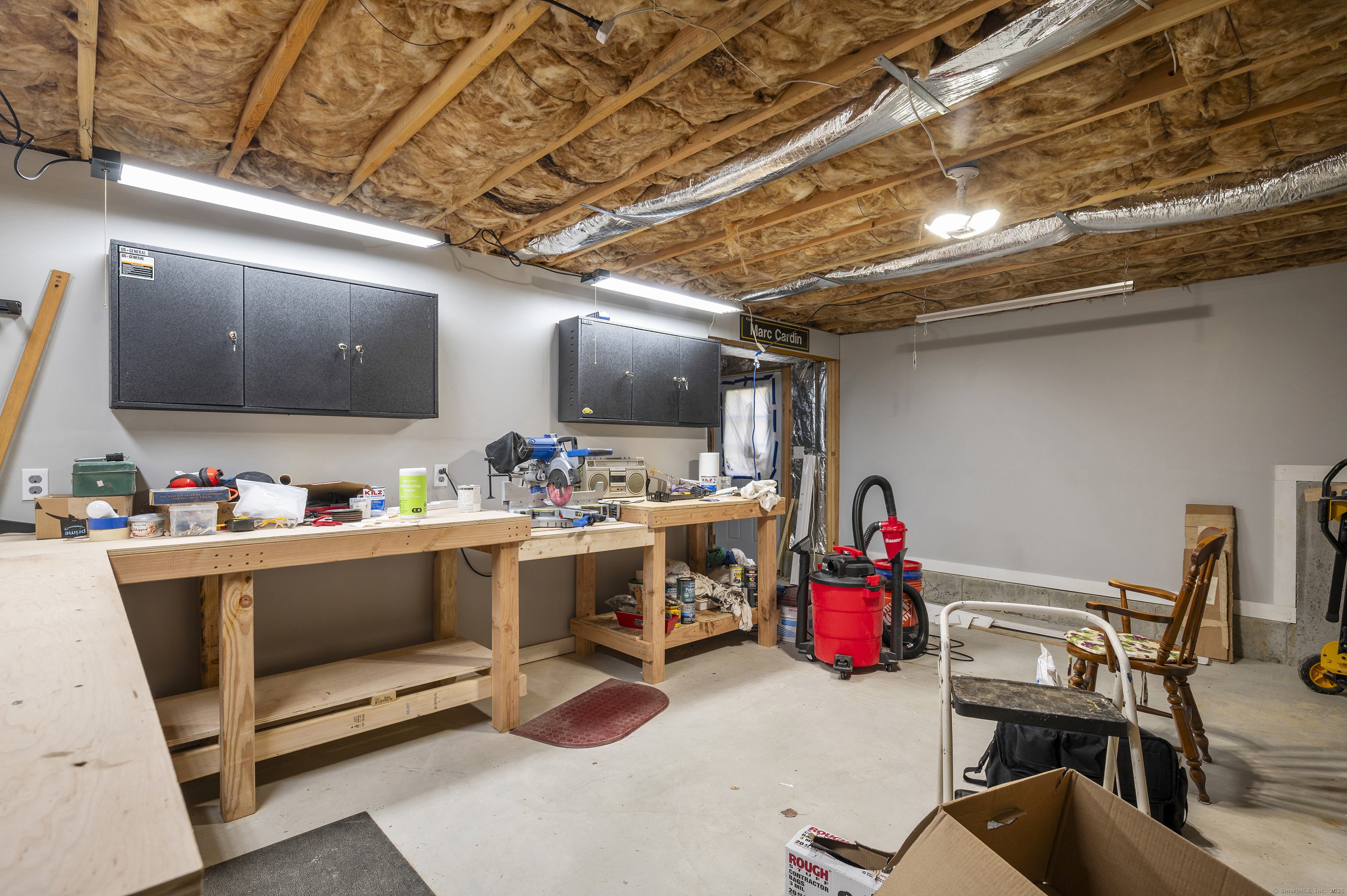 153 Wauregan Road Canterbury, CT 06331 - Photo 39 of 40 a room with stainless steel appliances kitchen island granite countertop lots of clutter