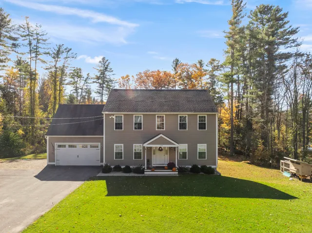a view of a house with a big yard
