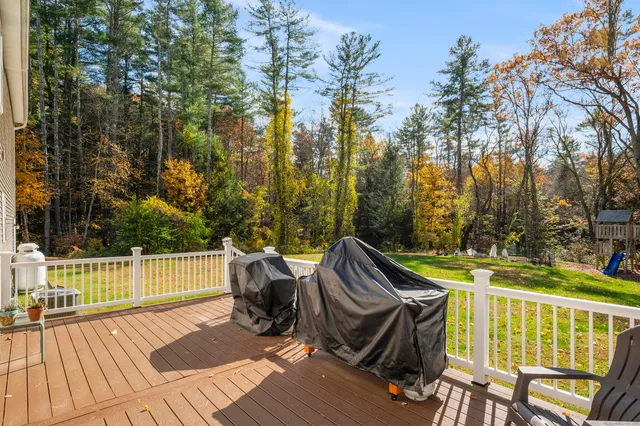 a view of a patio with iron fence