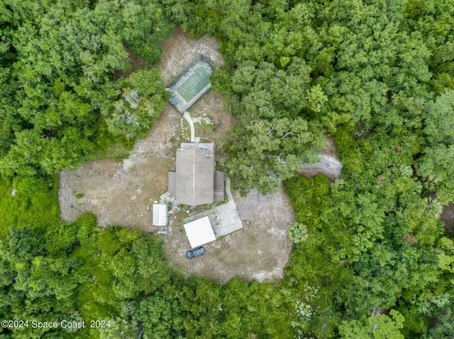 an aerial view of residential house with outdoor space