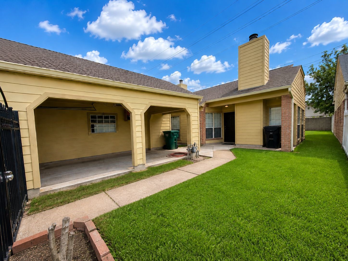 11840 Spring Grove Drive Houston, TX 77099 - Photo 2 of 27 Spacious front yard with covered porch and beautiful chimney detail