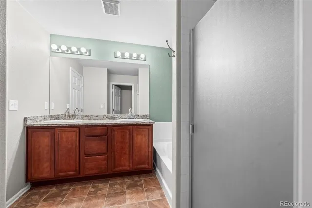 an empty room with wooden floor and window