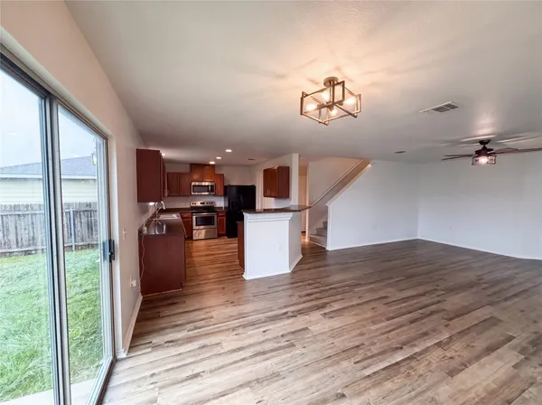 a view of kitchen and a wooden floor