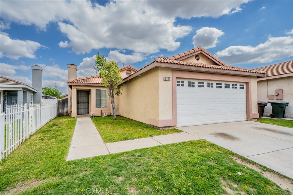 a front view of a house with yard
