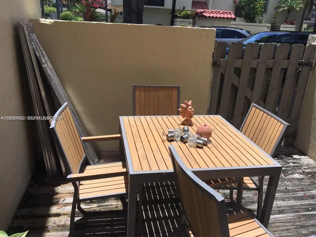 a view of balcony and wooden floor