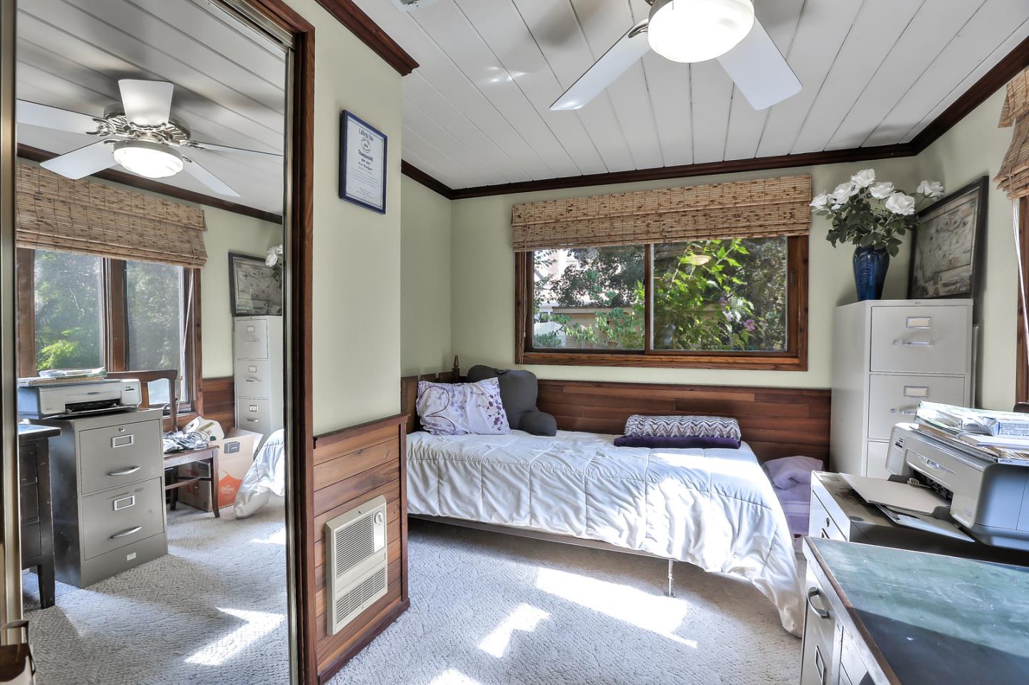 300 Riverside Avenue Ben Lomond, CA 95005 - Photo 14 of 22 a bedroom with furniture and a large window