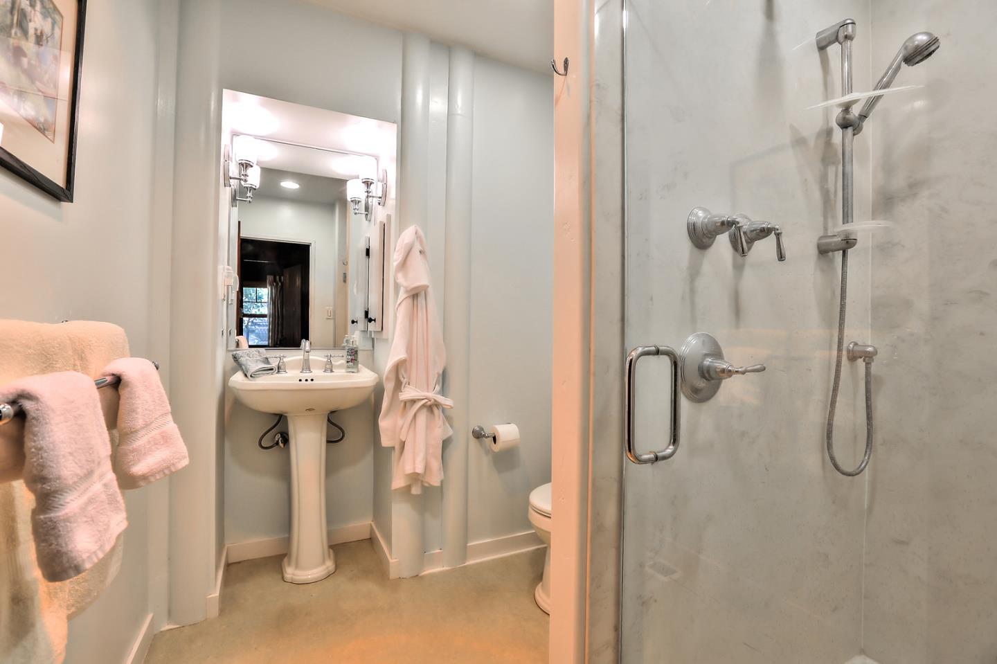 300 Riverside Avenue Ben Lomond, CA 95005 - Photo 16 of 22 a bathroom with a shower sink and mirror