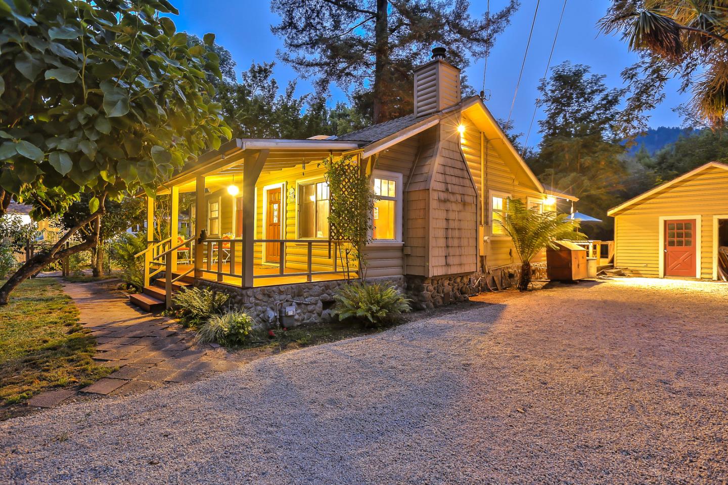 300 Riverside Avenue Ben Lomond, CA 95005 - Photo 3 of 22 a view of a house with large trees and plants