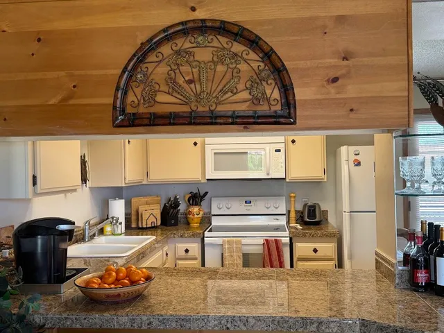 a bedroom with a bed and lamp