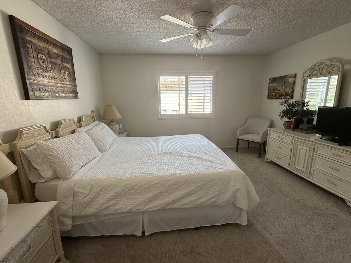 72822 Tony Trabert Lane Palm Desert, CA 92260 - Photo 15 of 23 a bedroom with bed and window