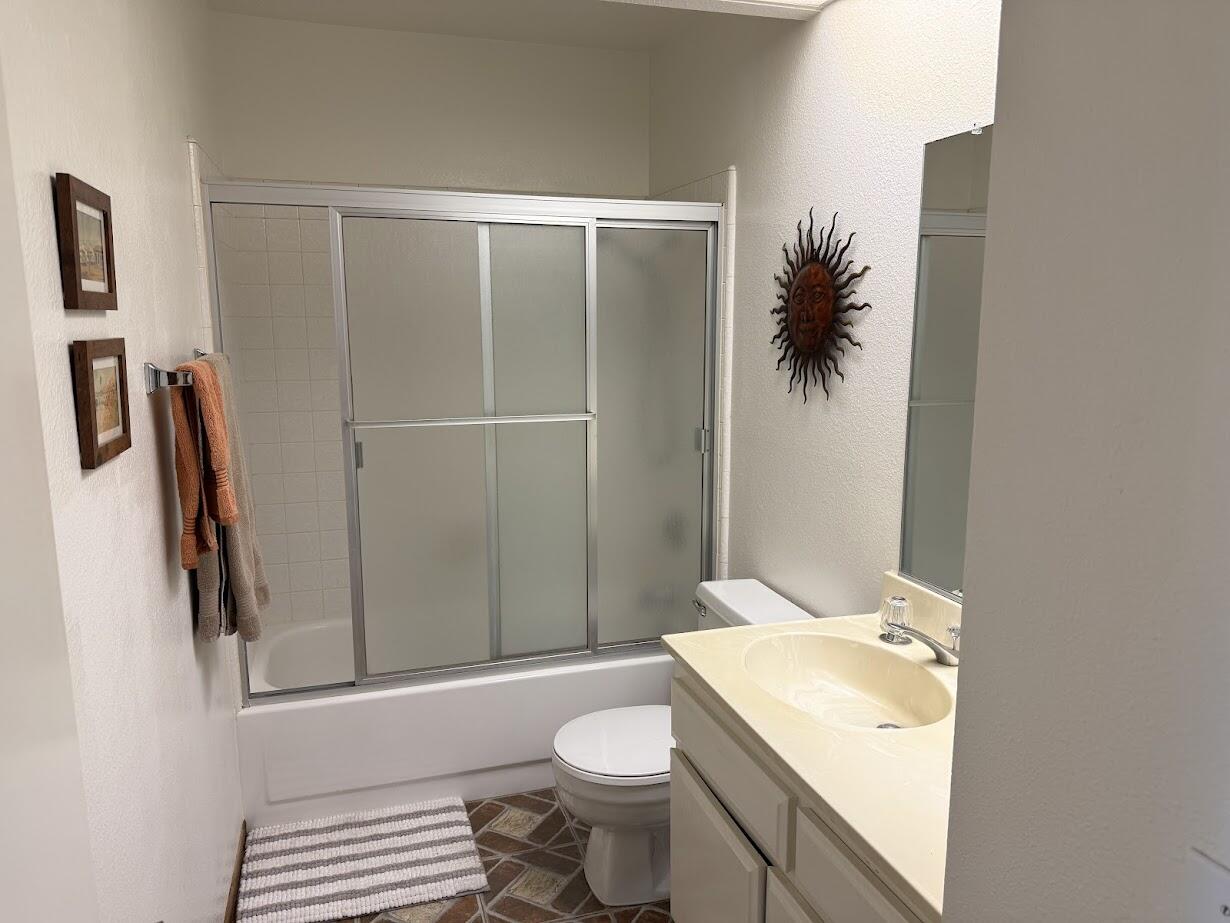 72822 Tony Trabert Lane Palm Desert, CA 92260 - Photo 21 of 23 a bathroom with a sink a toilet and shower