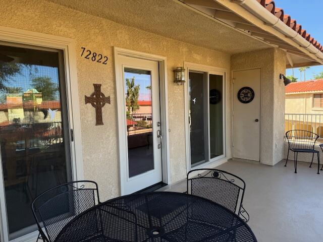 72822 Tony Trabert Lane Palm Desert, CA 92260 - Photo 4 of 23 a living room with furniture and a window