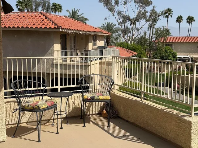 a view of a chairs and table on the deck